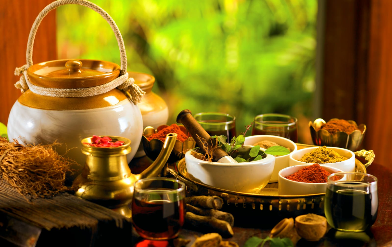 ayurveda herbs and oils on a table