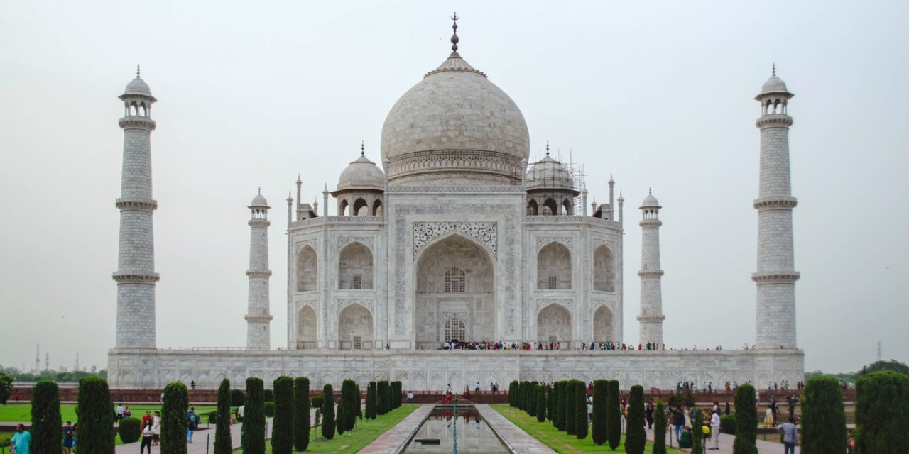 taj mahal front view white sky-greenish garden